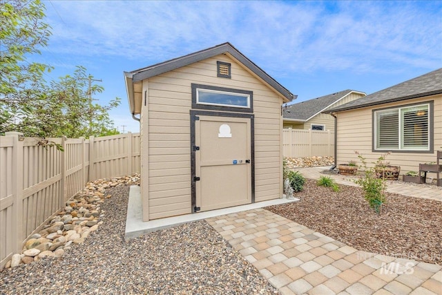 view of shed with a fenced backyard