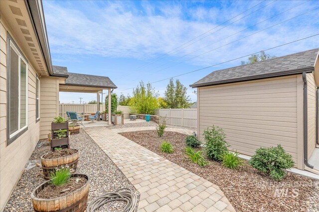 fenced backyard featuring a patio