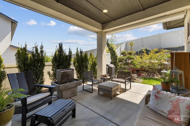 view of patio with an outdoor hangout area and a fenced backyard