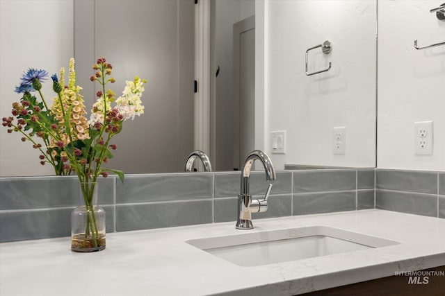 room details featuring backsplash and vanity