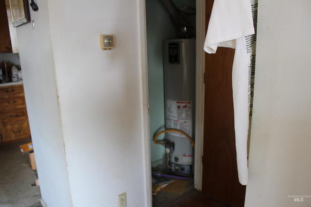 utility room with gas water heater