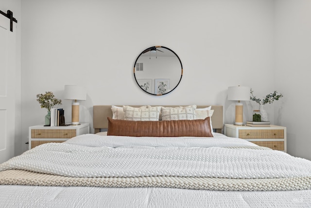 bedroom with a barn door