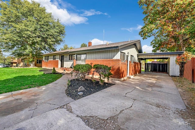 ranch-style house featuring a carport and a front yard