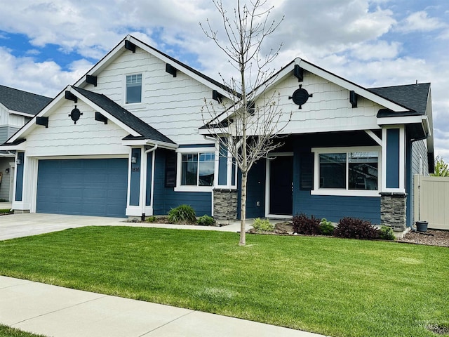 craftsman-style home with stone siding, driveway, and an attached garage