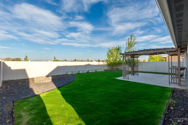 view of yard with a pergola and a patio area
