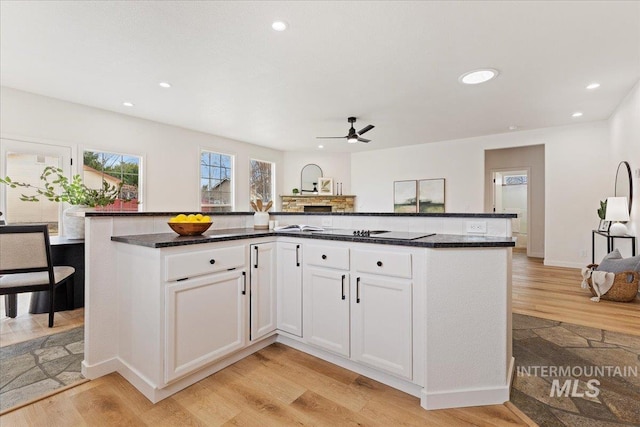 kitchen featuring recessed lighting, light wood-style flooring, white cabinets, and ceiling fan