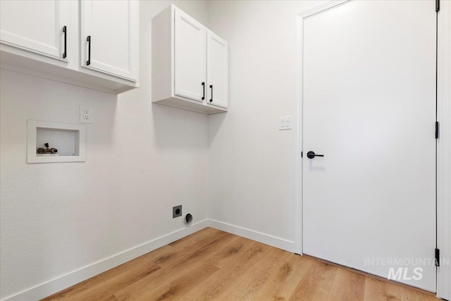 laundry area with electric dryer hookup, light wood-style flooring, cabinet space, baseboards, and hookup for a washing machine