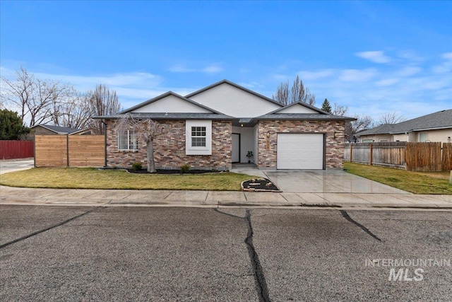 single story home with concrete driveway, a front yard, and fence