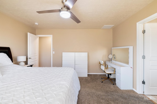 bedroom featuring ceiling fan, light carpet, and a textured ceiling