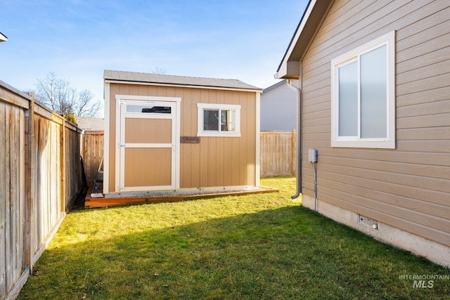 view of outbuilding with a lawn