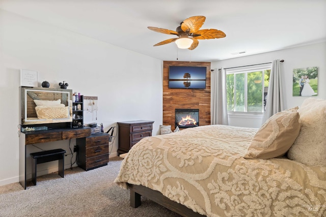 1509 N Cedar St, Jerome, ID 83338 - bedroom with carpet flooring, a fireplace, a ceiling fan, and baseboards