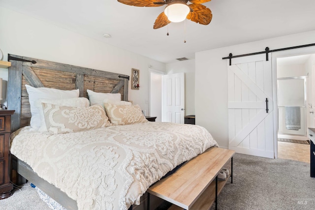 1509 N Cedar St, Jerome, ID 83338 - bedroom with a barn door, carpet floors, and a ceiling fan