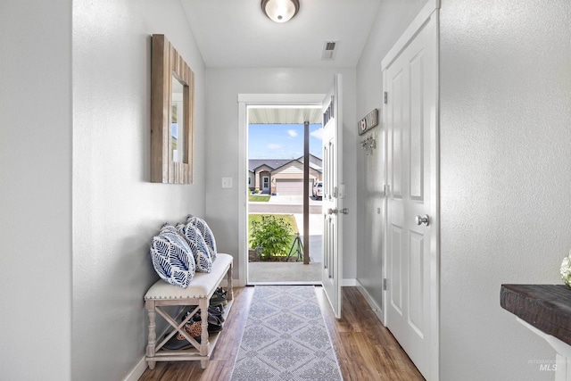 1509 N Cedar St, Jerome, ID 83338 - doorway to outside featuring baseboards and wood finished floors