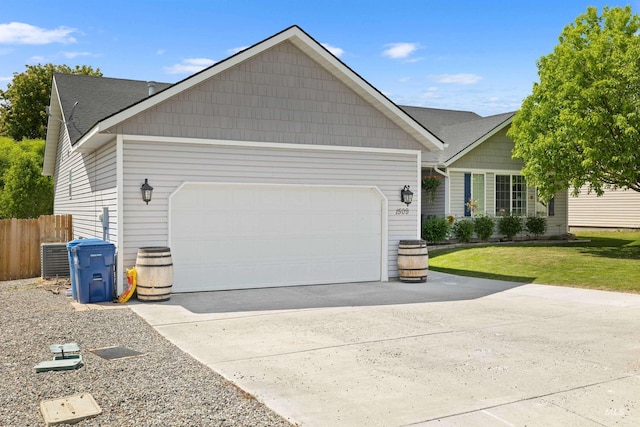 1509 N Cedar St, Jerome, ID 83338 - view of front of house with a garage, driveway, and central AC unit