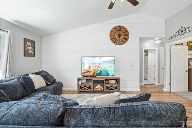 1509 N Cedar St, Jerome, ID 83338 - living area with vaulted ceiling, wood finished floors, a ceiling fan, and baseboards