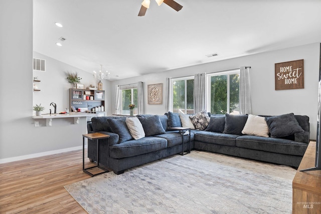 1509 N Cedar St, Jerome, ID 83338 - living room with healthy amount of natural light, light wood-style floors, a ceiling fan, a chandelier, and recessed lighting