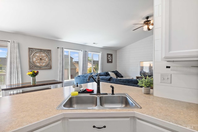 1509 N Cedar St, Jerome, ID 83338 - kitchen with a sink, light countertops, vaulted ceiling, open floor plan, and white cabinets
