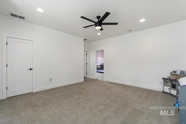 unfurnished bedroom featuring carpet floors, visible vents, and recessed lighting