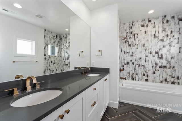 full bathroom with recessed lighting, visible vents, a sink, and double vanity