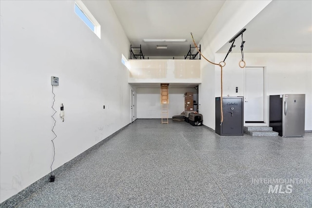 garage featuring freestanding refrigerator