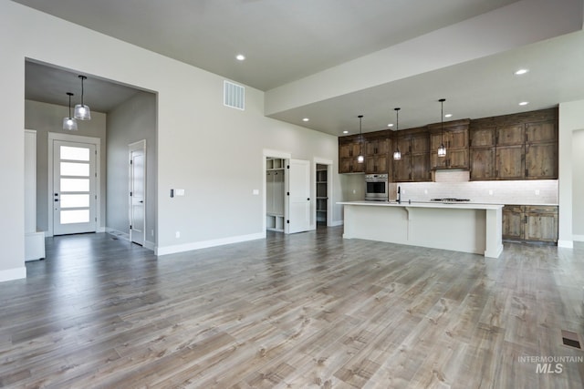 275 Meadow View Dr, Payette, ID 83661 - unfurnished living room with light wood-type flooring and recessed lighting