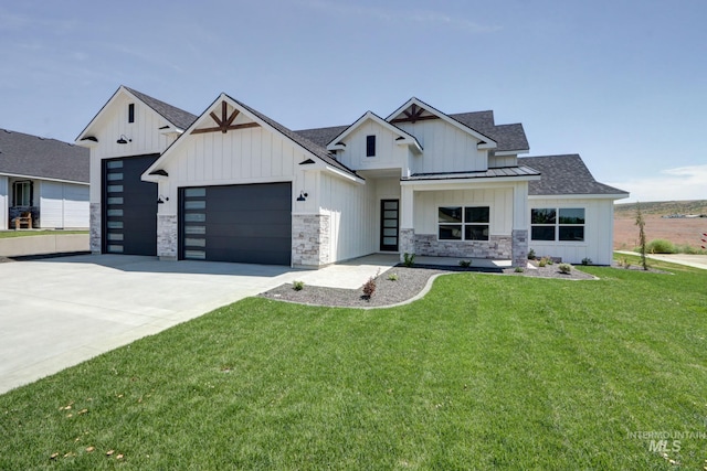 275 Meadow View Dr, Payette, ID 83661 - modern inspired farmhouse featuring an attached garage, a standing seam roof, roof with shingles, concrete driveway, and a front lawn