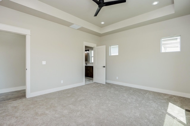 275 Meadow View Dr, Payette, ID 83661 - spare room featuring a ceiling fan, light carpet, healthy amount of natural light, a tray ceiling, and recessed lighting