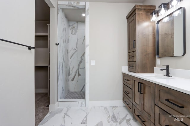 275 Meadow View Dr, Payette, ID 83661 - full bath featuring a marble finish shower, vanity, a walk in closet, and marble look tiles