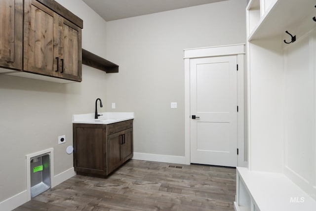 275 Meadow View Dr, Payette, ID 83661 - laundry room with electric dryer hookup, cabinet space, and light wood-type flooring