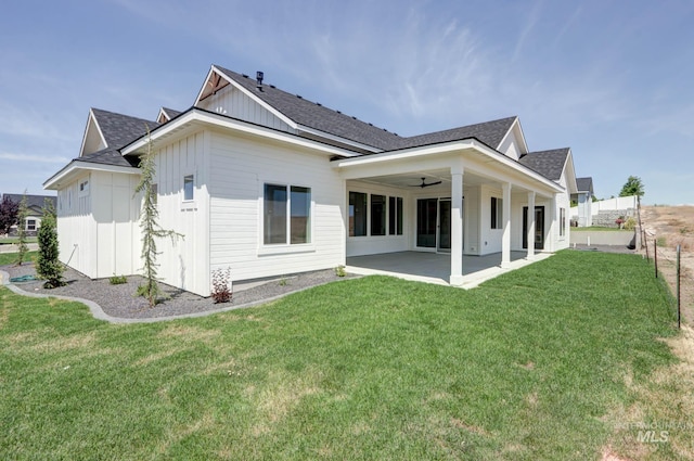 275 Meadow View Dr, Payette, ID 83661 - rear view of house with board and batten siding, a patio area, and a yard