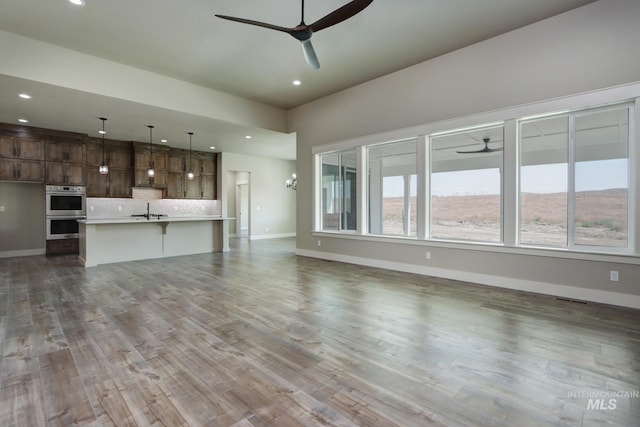 275 Meadow View Dr, Payette, ID 83661 - unfurnished living room with a ceiling fan, recessed lighting, and wood finished floors