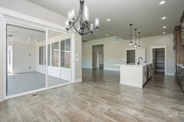 275 Meadow View Dr, Payette, ID 83661 - kitchen featuring a chandelier, open floor plan, light countertops, recessed lighting, and light wood-style floors