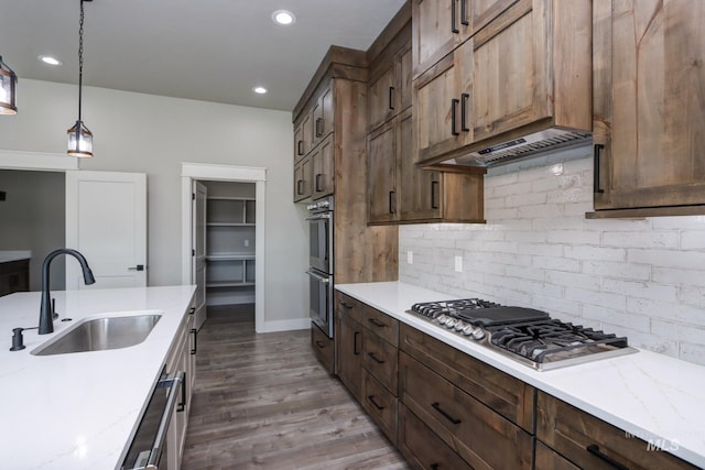 275 Meadow View Dr, Payette, ID 83661 - kitchen with appliances with stainless steel finishes, tasteful backsplash, wood finished floors, pendant lighting, and recessed lighting
