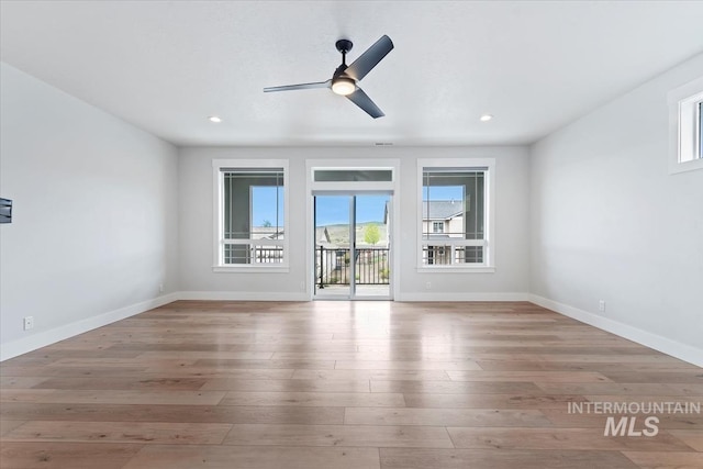19322 N Shepherds Pie Pl, Boise, ID 83714 - empty room featuring wood finished floors, a ceiling fan, baseboards, and recessed lighting
