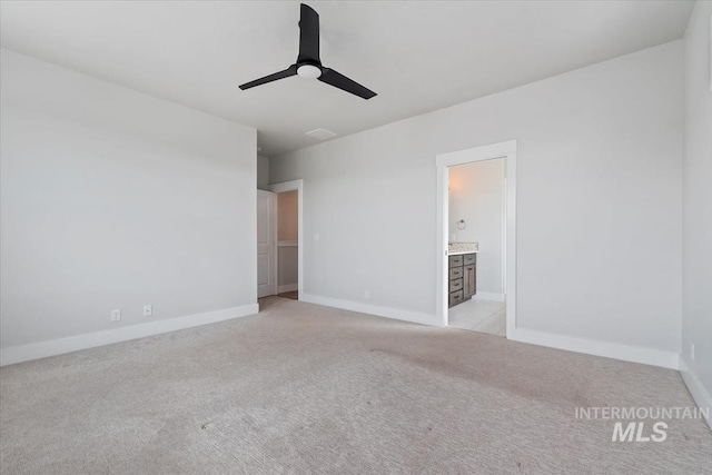 19322 N Shepherds Pie Pl, Boise, ID 83714 - unfurnished bedroom with light carpet, baseboards, connected bathroom, and a ceiling fan