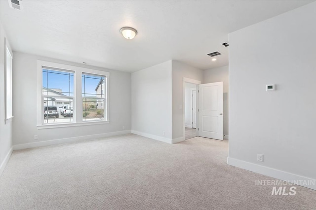 19322 N Shepherds Pie Pl, Boise, ID 83714 - spare room featuring light colored carpet and baseboards