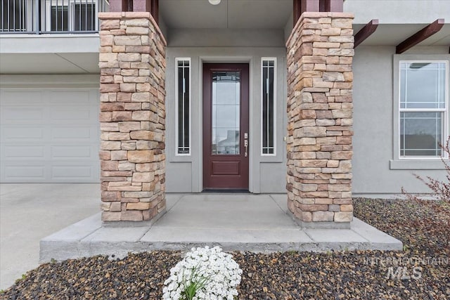 19322 N Shepherds Pie Pl, Boise, ID 83714 - property entrance featuring stucco siding, stone siding, and a garage