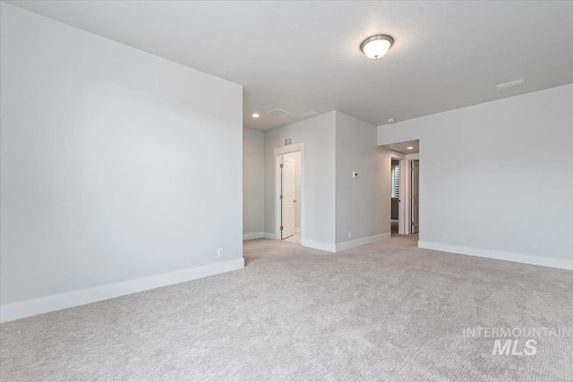 19322 N Shepherds Pie Pl, Boise, ID 83714 - unfurnished room with light colored carpet, recessed lighting, and baseboards