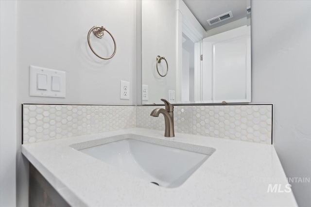 19322 N Shepherds Pie Pl, Boise, ID 83714 - bathroom with tasteful backsplash and vanity
