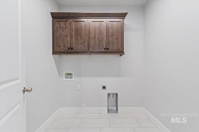 19322 N Shepherds Pie Pl, Boise, ID 83714 - washroom featuring washer hookup, electric dryer hookup, light marble finish floors, baseboards, and cabinet space