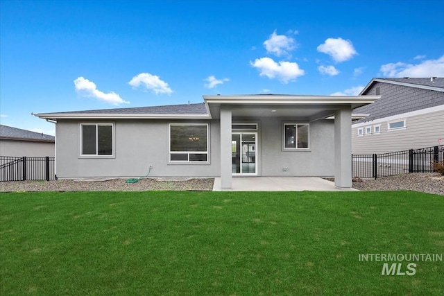 19322 N Shepherds Pie Pl, Boise, ID 83714 - rear view of house with stucco siding and a patio area