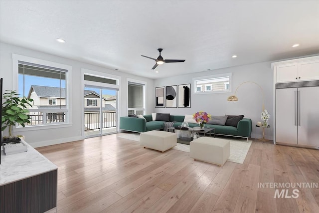 19322 N Shepherds Pie Pl, Boise, ID 83714 - living area featuring light wood finished floors, a ceiling fan, recessed lighting, and baseboards