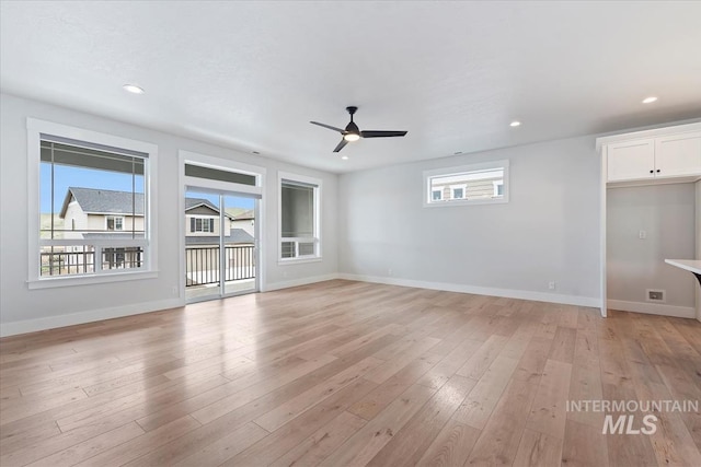 19322 N Shepherds Pie Pl, Boise, ID 83714 - unfurnished living room with ceiling fan, recessed lighting, baseboards, and light wood-type flooring