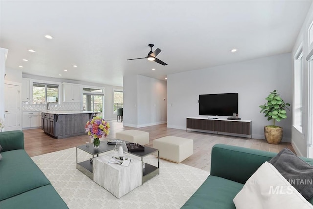 19322 N Shepherds Pie Pl, Boise, ID 83714 - living area with light wood-style floors, a ceiling fan, recessed lighting, and baseboards