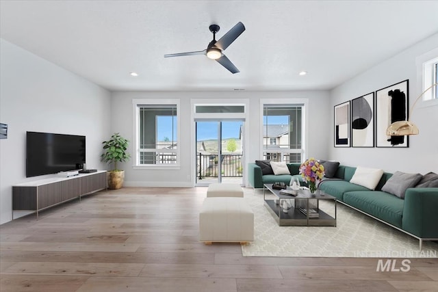 19322 N Shepherds Pie Pl, Boise, ID 83714 - living room with wood finished floors, ceiling fan, recessed lighting, and baseboards