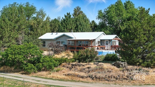 103 W 420 N, Shoshone, ID 83352 - view of front of house featuring a deck and a metal roof