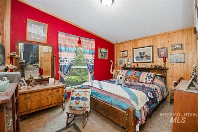 103 W 420 N, Shoshone, ID 83352 - bedroom featuring lofted ceiling, ornamental molding, carpet, a textured ceiling, and wood walls