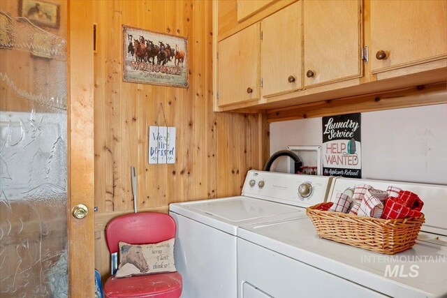 103 W 420 N, Shoshone, ID 83352 - laundry area featuring cabinet space, separate washer and dryer, and wooden walls