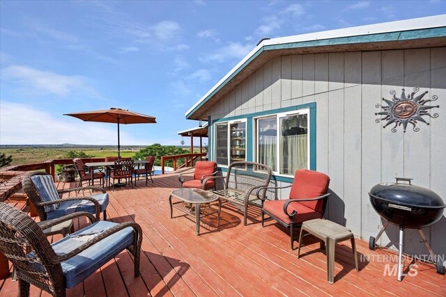 103 W 420 N, Shoshone, ID 83352 - wooden terrace featuring a grill and outdoor dining space