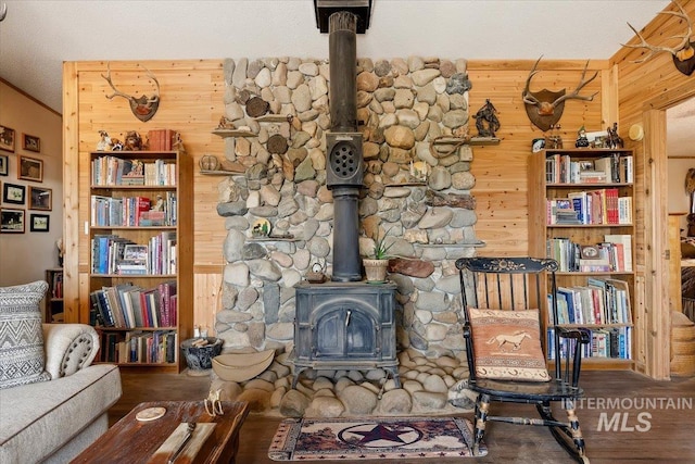 103 W 420 N, Shoshone, ID 83352 - living area featuring a wood stove, wood walls, and wood finished floors